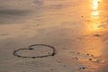 Heart shaped drawing on the beach with copy space. Valentine day and Marry Concept
