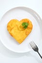 Heart shaped escalope of veal in breadcrumbs