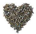 A heart shaped figure laid out from various assorted rusty metal old bolts, screws, nails, nuts. The concept of metallic Royalty Free Stock Photo