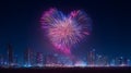 Heart shaped fireworks exploding over a city skyline at night time Royalty Free Stock Photo