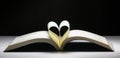 Heart-shaped folding book in the backdrop, Concept ideas for reading and love, soft-focus bokeh background Royalty Free Stock Photo