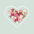 Heart shaped frame with colorful spring flowers inside. Royalty Free Stock Photo