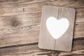 Heart shaped frame on wooden background Royalty Free Stock Photo