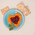 Heart shaped fresh salad and cookies for Valentine's Day.