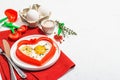 Heart-shaped fried egg served with toasted bread. Romantic art food idea for Valentine\'s breakfast Royalty Free Stock Photo