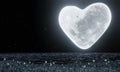 A heart-shaped full moon with full stars in the sky. The moon reflected on the water`s surface..The grass has flowers on the fiel Royalty Free Stock Photo