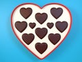 Heart shaped gift box having chocolates. 3D. Royalty Free Stock Photo