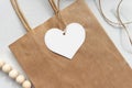 Heart shaped gift tag label on a brown paper bag Royalty Free Stock Photo