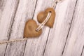 Heart shaped ginger cookies over white wooden background