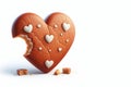 Heart-shaped gingerbread with the edge bitten off. Space for text. Royalty Free Stock Photo