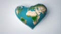 heart-shaped globe A white background with a heart-shaped earth on it. The earth is blue and green and has some continents Royalty Free Stock Photo