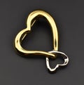 Heart shaped gold brooch on black background. Valentines day concept Royalty Free Stock Photo