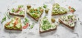 Heart-shaped gourmet canapes on healthy rye bread Royalty Free Stock Photo