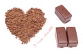 Heart shaped grated chocolate and three candies on white background Royalty Free Stock Photo