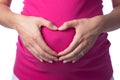 Heart Shaped Hands on a Pregnant Belly Royalty Free Stock Photo