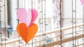 2 heart shaped hanging on wires and blurred Royalty Free Stock Photo