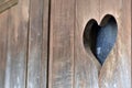 Heart-shaped hole carved into wooden door
