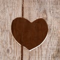 A heart shaped hole cut in a wooden door Royalty Free Stock Photo