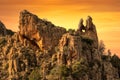 Heart-shaped hole in rock in The Calanches in Corsica at sunset Royalty Free Stock Photo