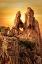 Heart-shaped hole in rock in The Calanches in Corsica at sunset Royalty Free Stock Photo