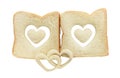 Heart shaped hole in a slice of bread isolated Royalty Free Stock Photo