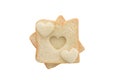 Heart shaped hole in a slice of bread isolated Royalty Free Stock Photo