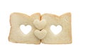 Heart shaped hole in a slice of bread isolated Royalty Free Stock Photo