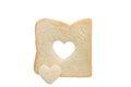 Heart shaped hole in a slice of bread isolated Royalty Free Stock Photo