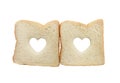 Heart shaped hole in a slice of bread isolated Royalty Free Stock Photo