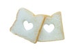 Heart shaped hole in a slice of bread isolated Royalty Free Stock Photo