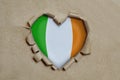Heart Shaped Hole Torn Through Paper, Showing Irish Flag