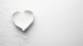 A heart shaped hole in a white paper with a torn edge. The paper is on a white background and the heart shape is in the Royalty Free Stock Photo