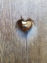 Heart shaped hole in wood Royalty Free Stock Photo