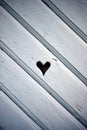 Heart shaped hole in wooden shutter Royalty Free Stock Photo