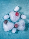 Heart shaped ice cubes with frozen cherry Royalty Free Stock Photo