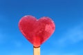 Heart shaped ice in front of the summer sky Royalty Free Stock Photo