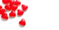 Heart shaped jelly candy, love background. Red jelly sweets candies on white backdrop. St. Valentines, marriage hearts border