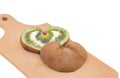 Heart shaped kiwi fruit on wooden board Royalty Free Stock Photo