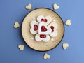 Heart shaped linzer cookies on a plate, blue background Royalty Free Stock Photo