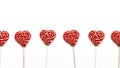 Heart Shaped Lollipops In Row On White Background. Global Concept And Symbol Of Love. Love and Holiday Greeting Card Background Royalty Free Stock Photo