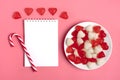 Heart-shaped marmalade, white notepad, flamingo pen on a pink background Happy Valentine`s Day Royalty Free Stock Photo