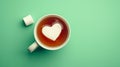 Heart-shaped marshmallow floating in tea cup Royalty Free Stock Photo
