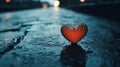 A heart shaped object sitting on a wet road with rain drops, AI