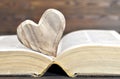 Heart shaped ornament and an old book Royalty Free Stock Photo