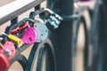 Heart-shaped padlock hanging on a bridge. Royalty Free Stock Photo