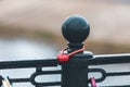 Heart-shaped padlock hanging on a bridge. Royalty Free Stock Photo