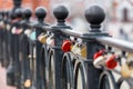 Heart-shaped padlock hanging on a bridge. Royalty Free Stock Photo