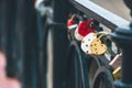 Heart-shaped padlock hanging on a bridge. Royalty Free Stock Photo