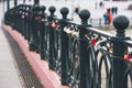 Heart-shaped padlock hanging on a bridge. Royalty Free Stock Photo