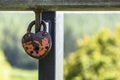 Heart-Shaped Padlock Hanging on Rails Among Other Variegated Padlocks Royalty Free Stock Photo